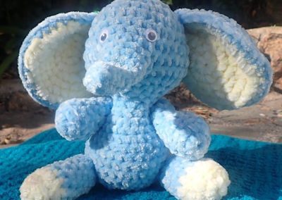 Soft crochet toy elephant sitting